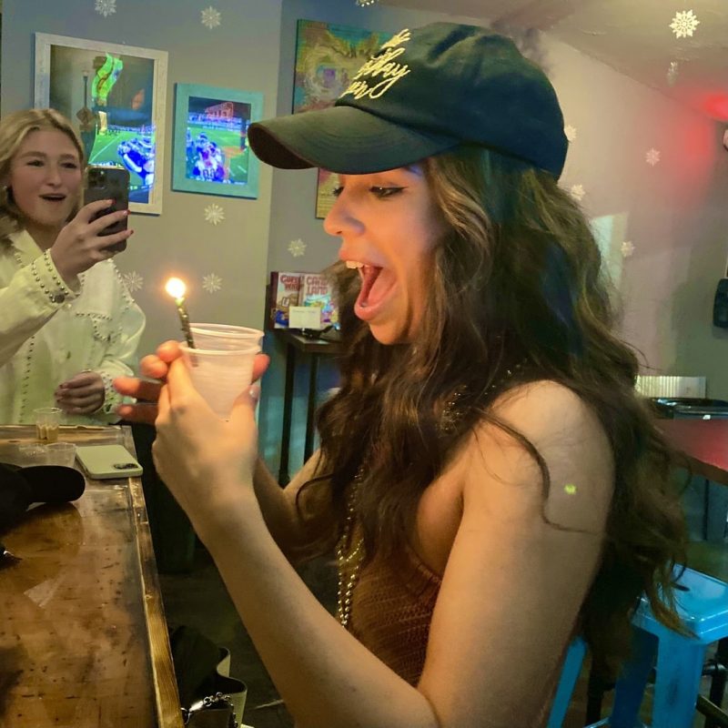 Girl With Frozen Shot Blowing Out Birthday Candle At MJ's Chill Spot In Nashville