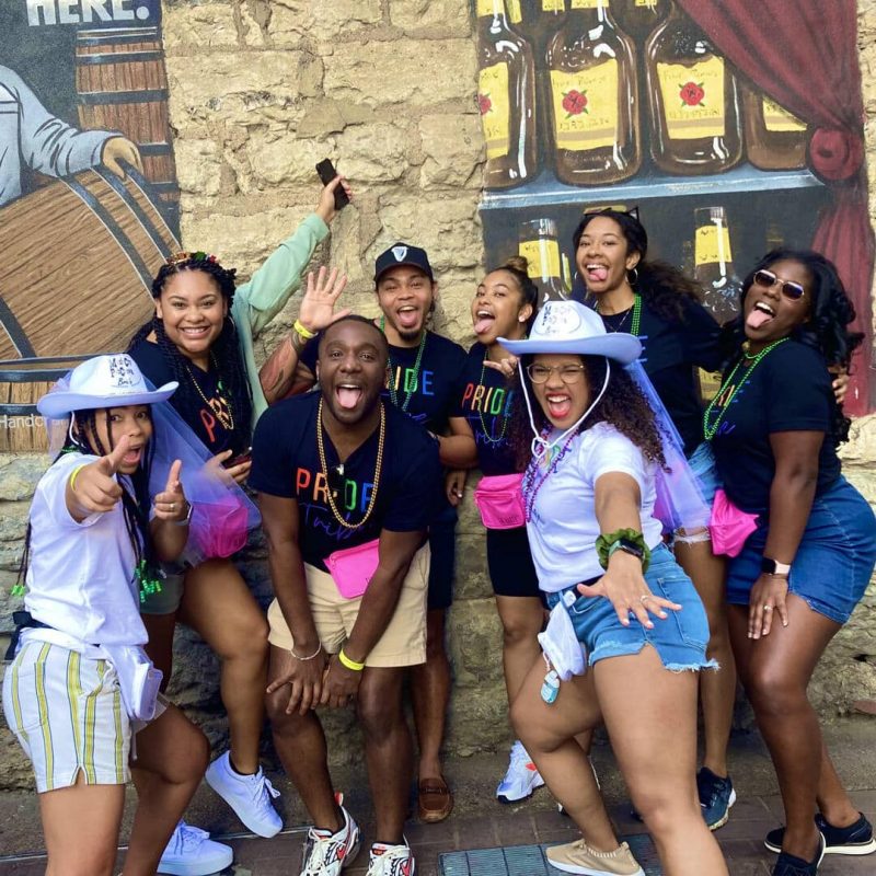 Double Bride Bachelorette Bar Crawl Group Posing In Front Of Printers Alley Mural
