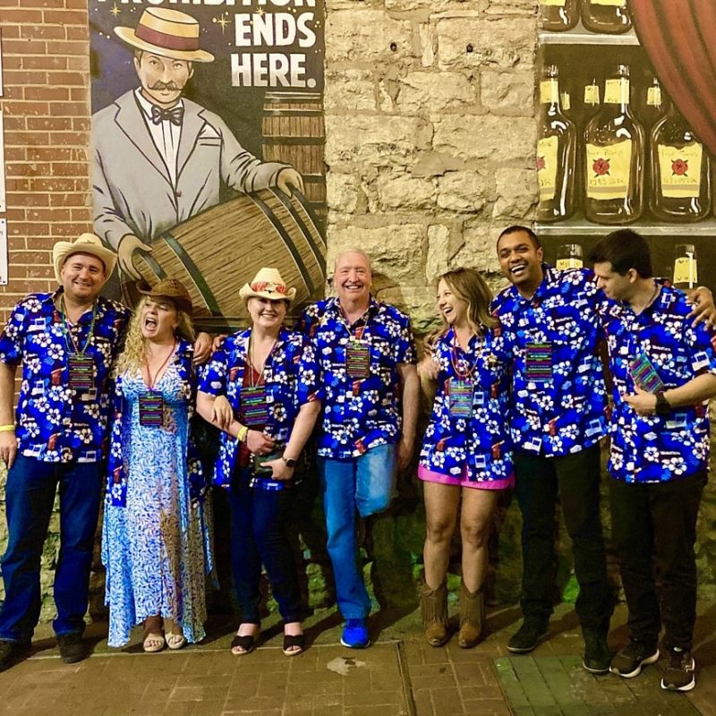 Corporate Pub Crawl Particpants Posing For A Photo Outside Alley Taps In Nashville