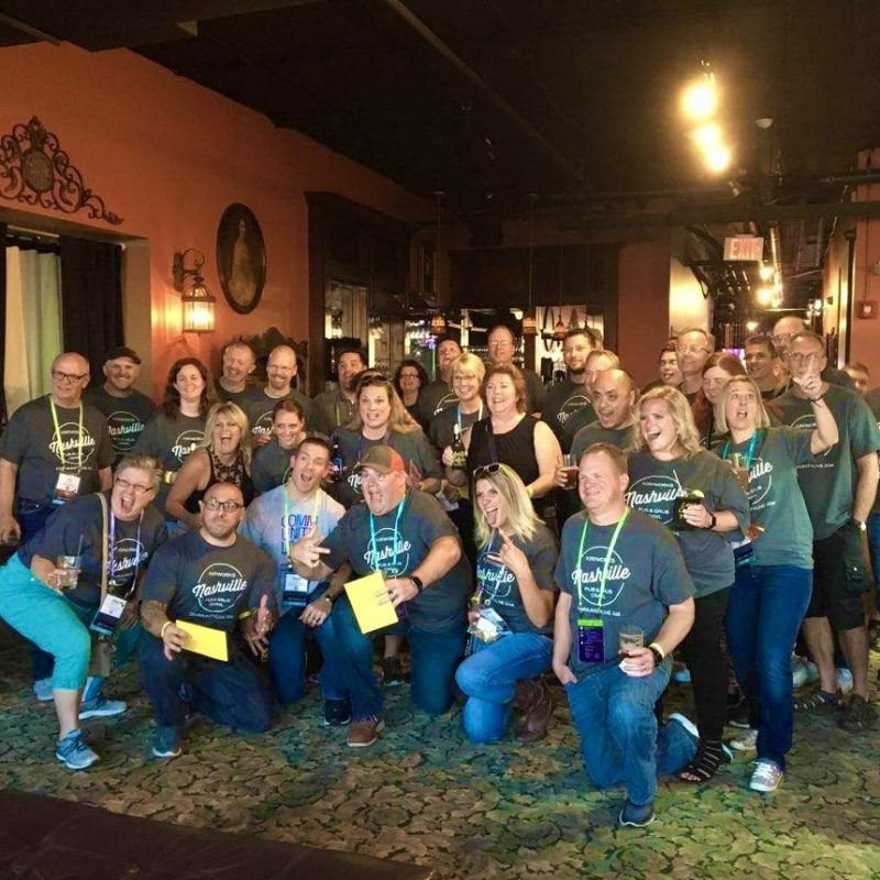 Nashville Convention Attendees Taking A Group Photo At Starting Bar