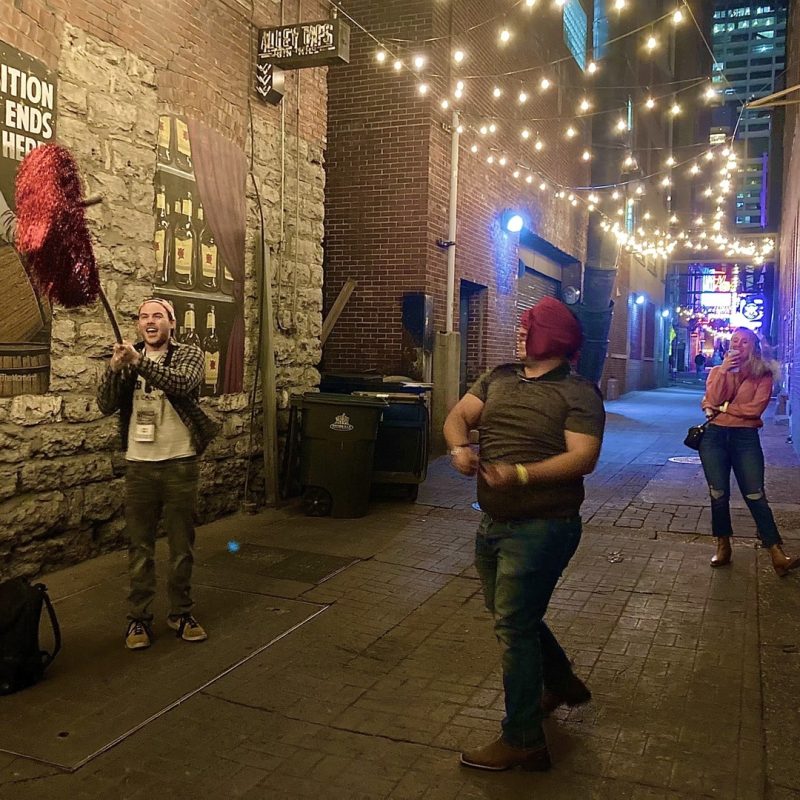 Tour Guest Hitting Heart Piñata In Downtown Nashville