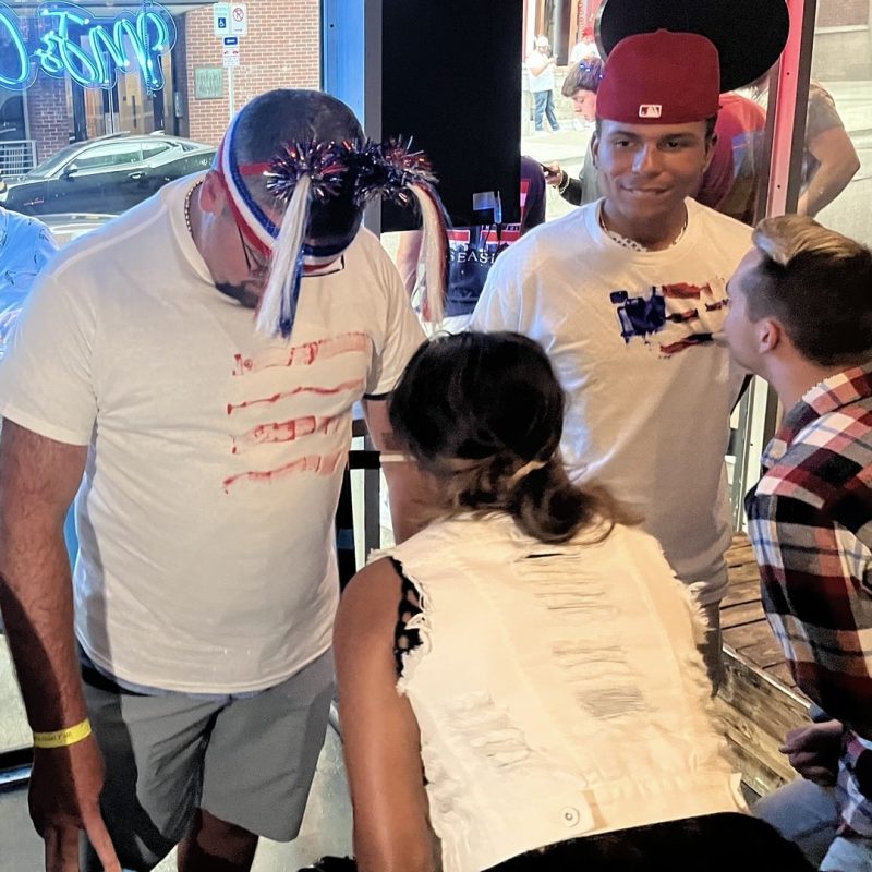 Teams Competing In T-shirt Painting Game On 4th Of July Bar Crawl